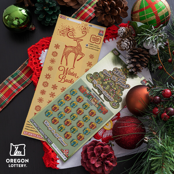 spread of a few scratch-it tickets on a table surrounded by greenery and ornaments